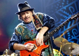 Carlos Santana coaxes sounds from his guitar during a show at the Philips Arena in Atlanta.